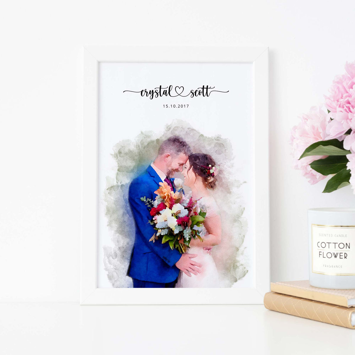 Watercolor-style portrait of a couple with a bouquet, in a white frame beside peonies, their names and a date above