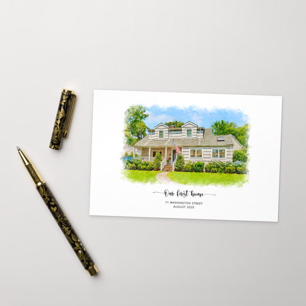 Postcard printed with a watercolor-style portrait of a white house, titled 'Our first home', beside a gold and black pen